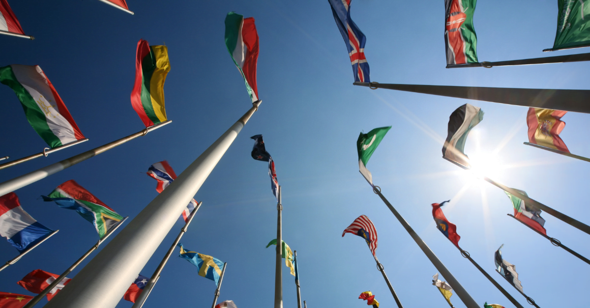 International flags flown agaisnt blue sky